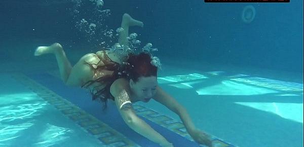  Small teen Mia Ferrari strips naked in pool